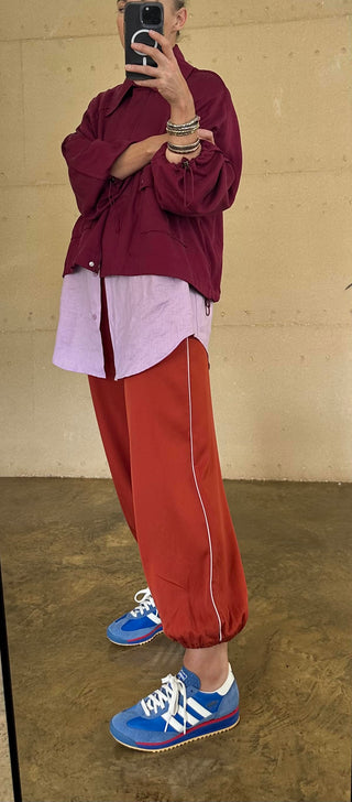 The Drift Track Pant - Paprika with Lilac Piping